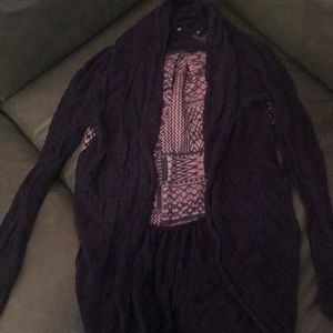 Purple knitted and knotted sweater